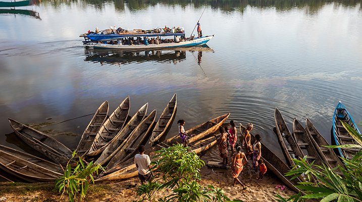 Andrevanto, Madagascar - November 10, 2016: Native people in a barge taxi along the Pangalanes Canal, eastern Madagascar